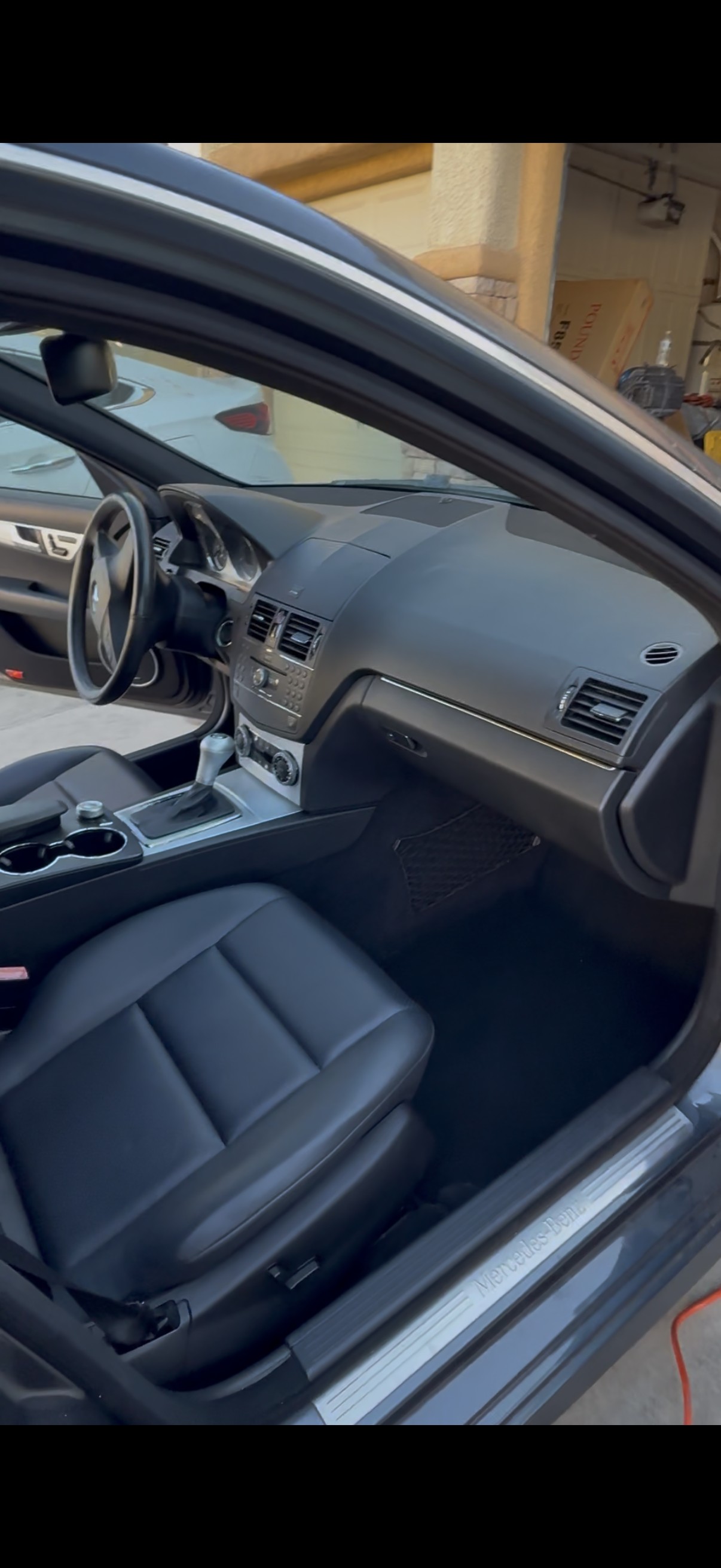 Detailed black leather interior of a Mercedes-Benz C-Class